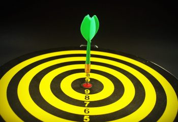 Dartboard target aim goal achievement concept